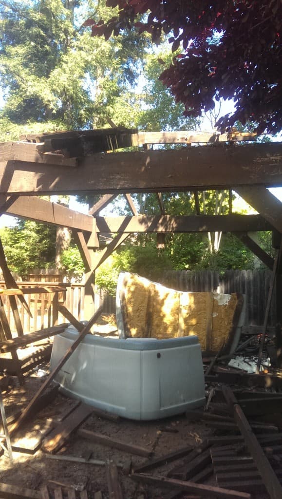Hot tub and demolished backyard structure ready for removal by JC Junk Hauling