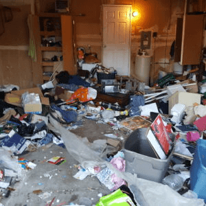 Heavily cluttered rental unit interior ready for full cleanout by JC Junk Hauling