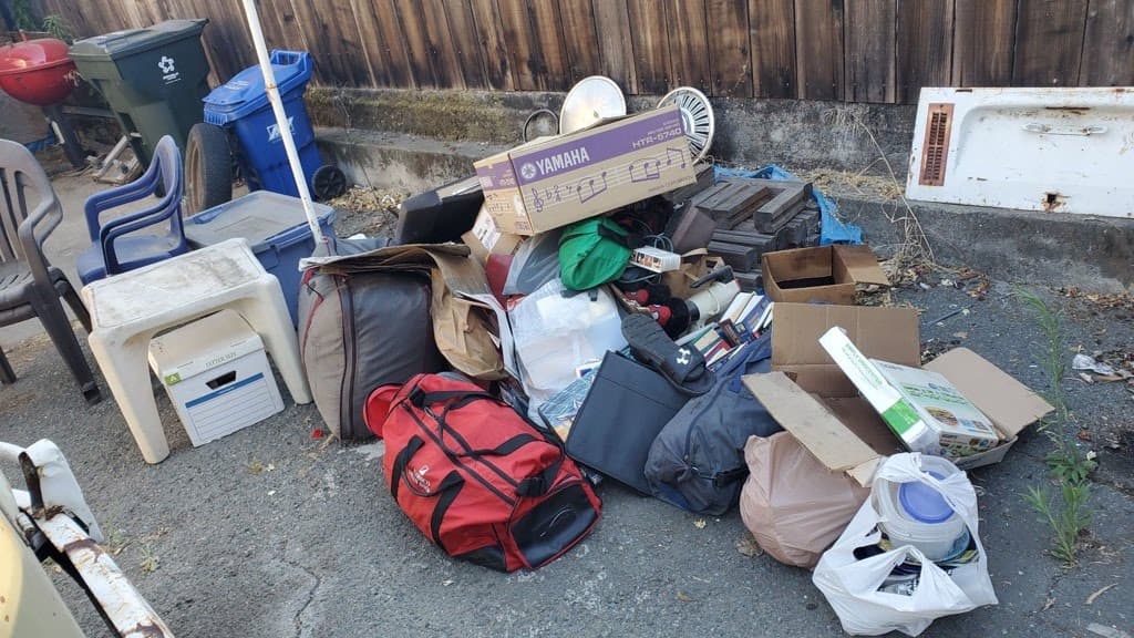 Large pile of junk and household items ready for removal by JC Junk Hauling