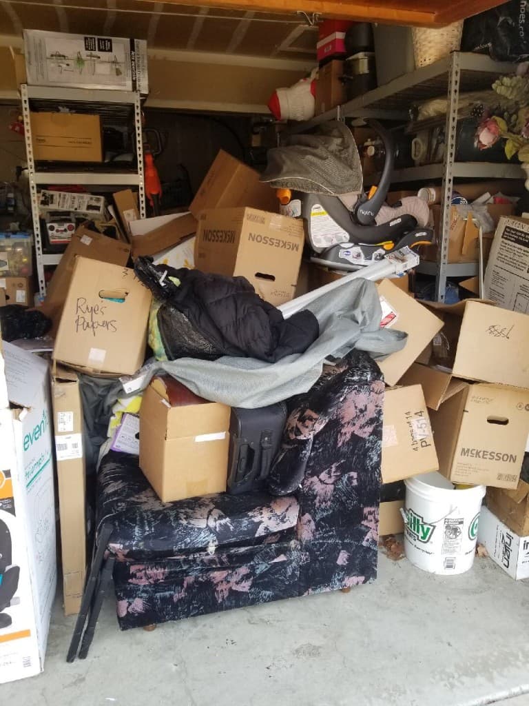 Cluttered garage before JC Junk Hauling cleanout
