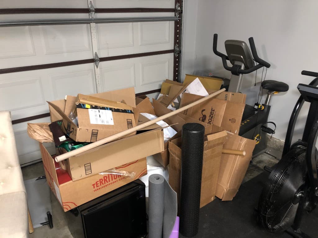 Packed garage and house items ready for full cleanout